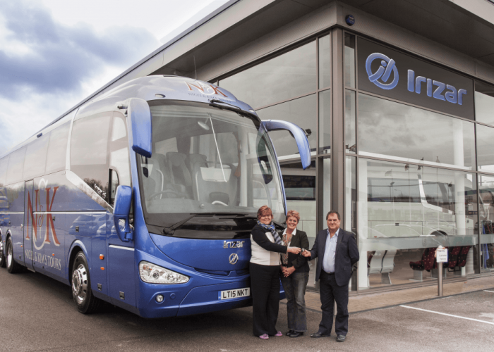 Julie Hartley (left) presents the keys of the new coach to Nigel and Kim Westbrook